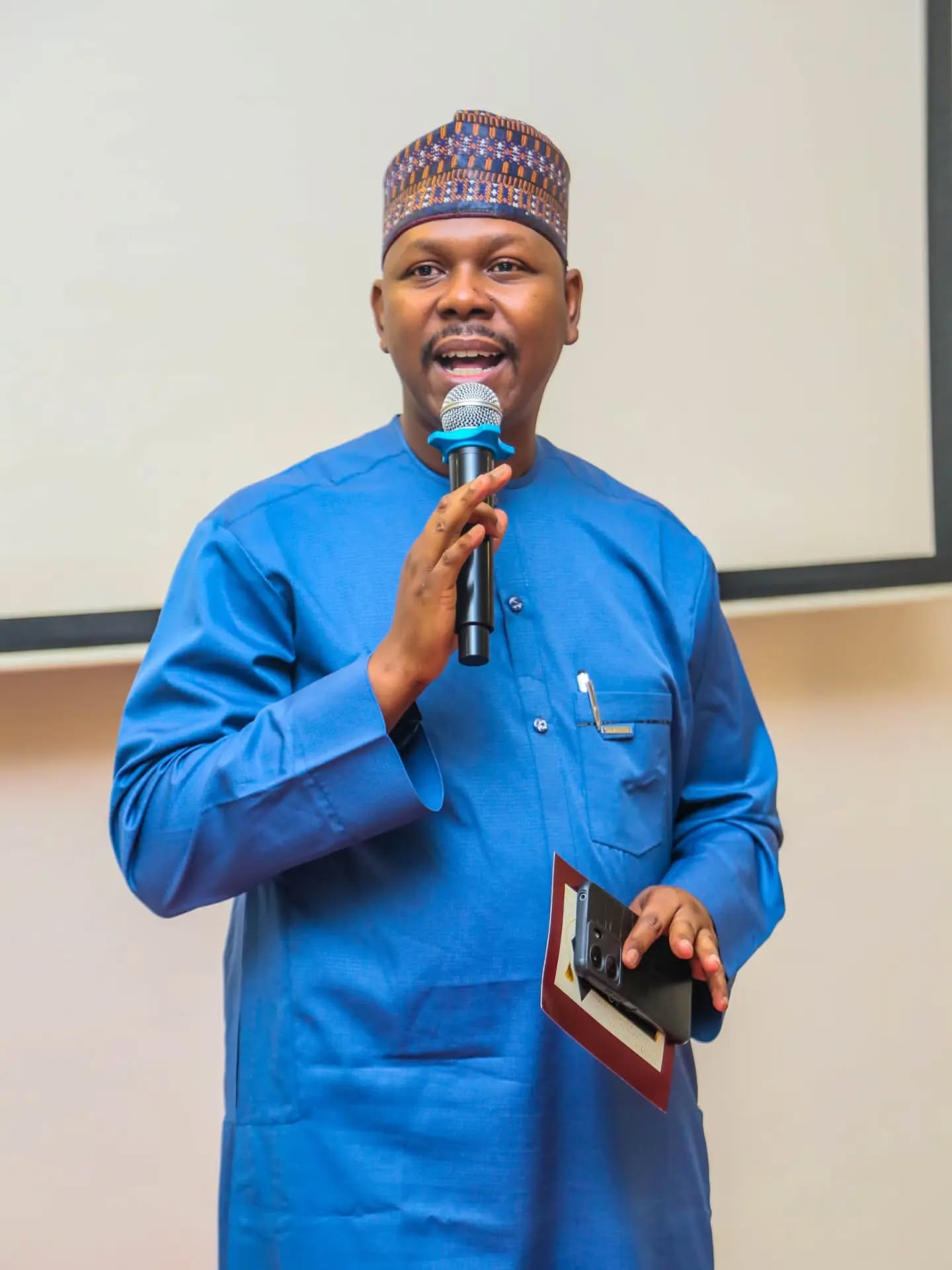 On stage — delivering remarks